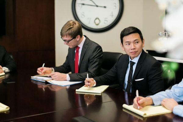 Professional license attorney and Partner John Bishop working with associate attorney Matthew Truong to defend an occupational license.