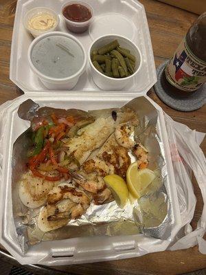 Grilled fish + 5 jumbo shrimp with 2 sides of green beans, tartar and cocktail sauce, and Texas unsweet tea.