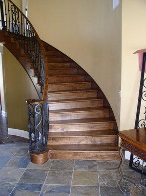 Solid stained Maple treads & 
 risers on curved staircase