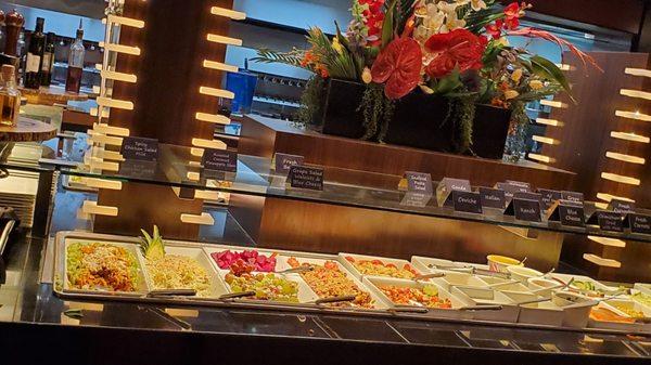 Unlimited Gourmet Salads/sides Bar. Fenced off with staff serving your selection.