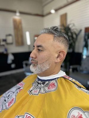 Mid/high Balled fade, razor line up.