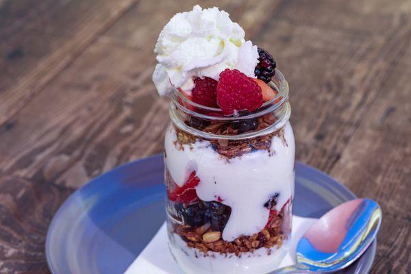 Light & fresh! Our Parfait is layers of fresh berries, greek yogurt & a house made coconut almond granola!