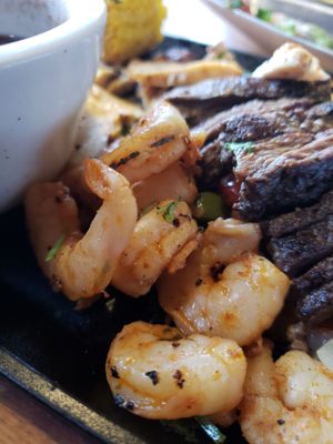 Fajitas platter, shrimp. Steak, chicken. The steak and chicken was about the size of a childs palm. Sweet peppers and onions for days!