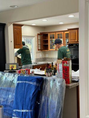 Professionals are packing the kitchen stuff. Almost there...