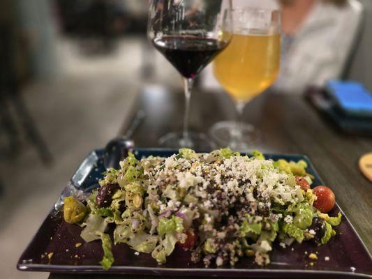 Mediterranean quinoa salad with cucumbers, grape tomatoes, red onion, kalamata olives, pistachios, feta, pepperoni with a lemon vinaigrette