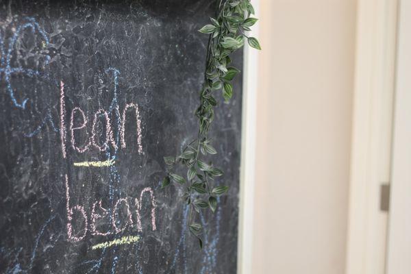 Chalk walls allow kids to use gross motor skills as they build imagery.