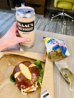 Pretzel bread sandwich, chips and 32oz crowler of beer