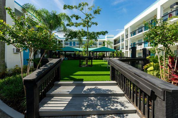 Entrance view of the courtyard and pool area.