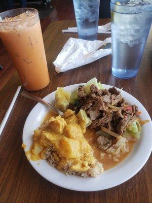 Chicken yellow curry, fried rice, spicy basil beef and steamed vegetables with a Thai tea.