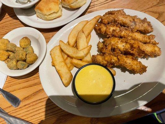 New breaded chicken fingers with honey mustard dipping sauce.