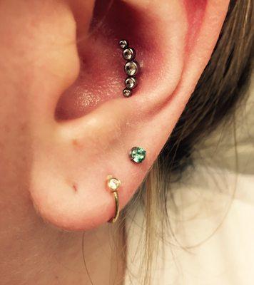 All jewelry purchased from Anatomic Body Arts. Leann pierced the third hole on the lobe and the conch. Love it!