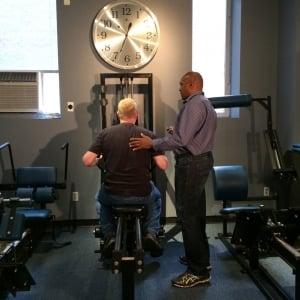 Anton Thompson and client on MedX seated row.