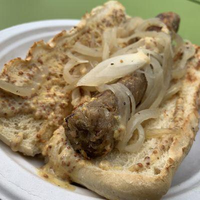 Beer Brat Sandwich from "Water & Wheat" at the People's Plant-Based Party on 10/8/23, sponsored by PFC & Vegan Kalamazoo.