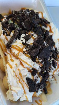 Bubble waffle w/ a scoop of mint & scoop of cookie dough topped w whipped cream , Oreos , & caramel