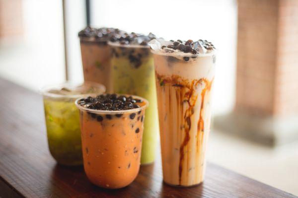 Front to back, left to right: tropical drink, Thai milk tea, Vietsubs milk tea, matcha milk tea, Okinawa milk tea