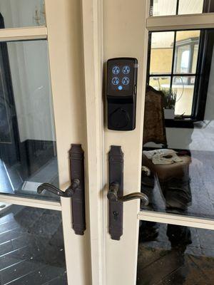 Smart keypad and fingerprint lock installation on french door.