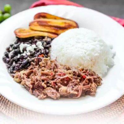 Pabellón Criollo: Arroz Blanco, Carne Mechada, Caraotas Negras, Plátano Maduro / White Rice, Shredded Beef, Black Beans, Ripe Plantain