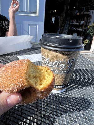 Pumpkin donut and hot apple cider with caramel