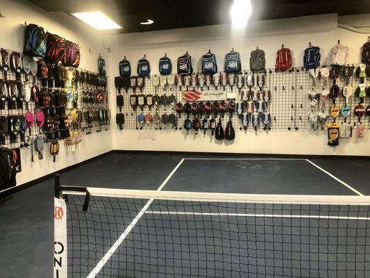 Interior with the mini-court to demo paddles. So helpful to try various paddle models and weights and get feedback from their staff.