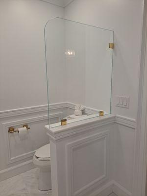 Glass toilet guard.