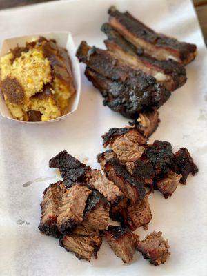 Burnt ends platter with a side of cornbread, and a quarter rack of ribs