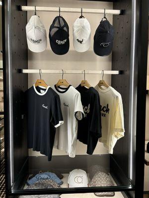 Sporty looking caps and fashionable tees @ Coach