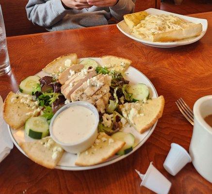 Greek salad with grilled chicken added, chicken fettuccine Alfredo with chicken.