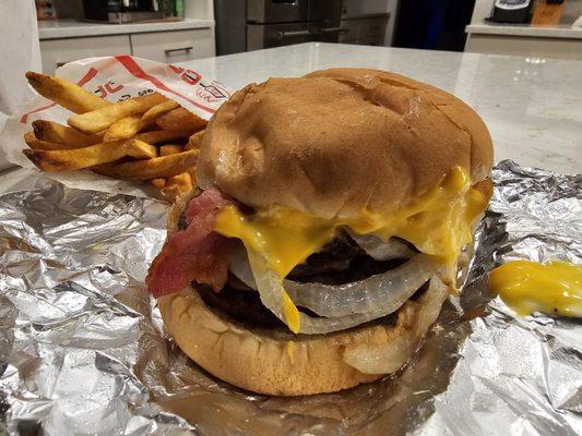 Huge cheddar style burger with Cajun fries.