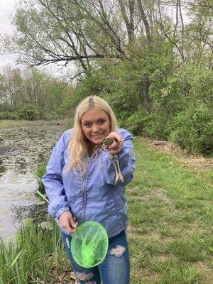 Maura caught a frog at local pond