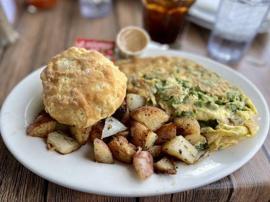 Asparagus cheese omelette with home fries and a biscuit