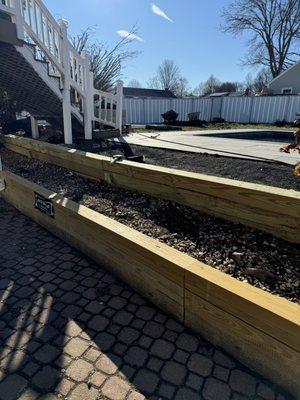 4x4x12 garden upgrade to 6x6x16 with a half a splash of stone dust on the backside of the garden bed.