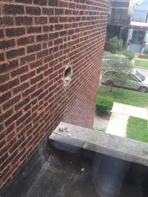 The hole created from removing our fireplace. Macario and his team fixed the hole with bricks that look identical to our building!