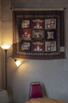 coffee-themed quilt on display.