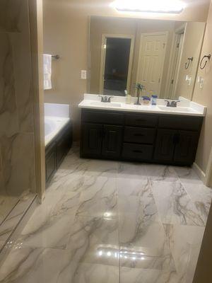 "After" picture of the bathroom we remolded with new cabinets and new floors