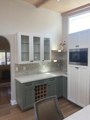 Built in oak wine rack and corner floating shelves.