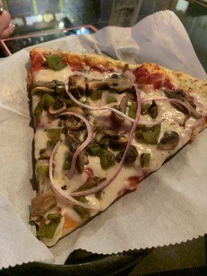 Pizza slice with peppers,onions and shrooms