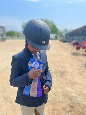 Our first horse show. Kid was thrilled to ride around the arena.