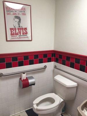 The bathroom fits the theme.