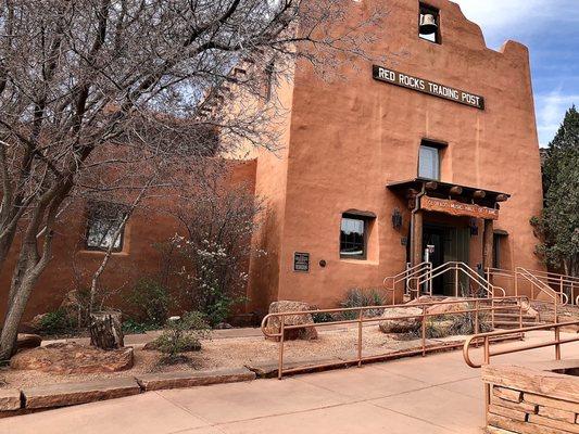 Outside! Trading post trail begins on the left side when facing the us building.