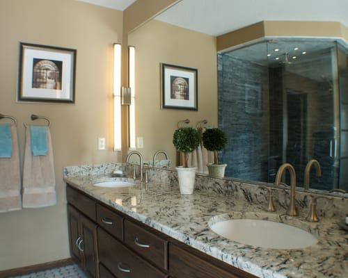 Adding granite to this counter top and a fresh coat of paint made this master bath feel new again.