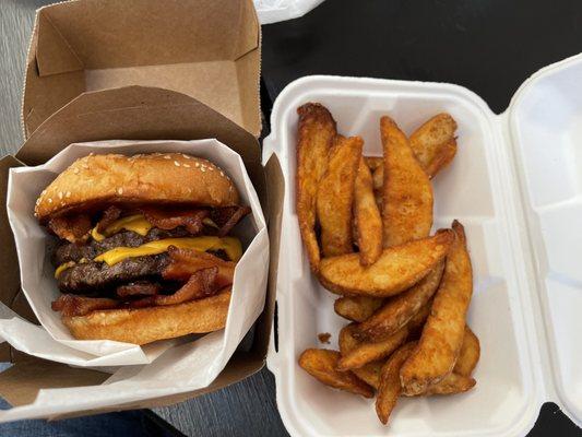 Double bacon cheeseburger with potato wedges