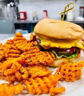 Old School Cheeseburger - angus beef patty, american cheese, onions, pickles, leafy greens, tomatoes, HC's signature sauce