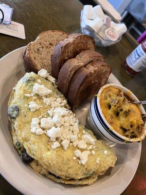 Greek omelet and grits w/ debris and cheese