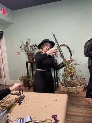 Hannah offering witch wreath making.