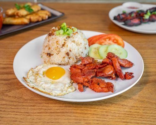 Pork Tocino with garlic rice & eggs cooked to order with tomato and cucumber.