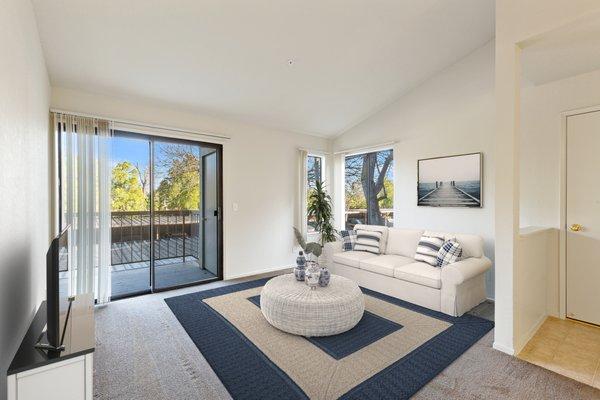 2 bed living room with sliding glass doors out to patio