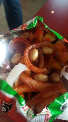 The best tostiloco ...diced jicama, pepino, cueritos, Japanese peanuts, mango, firm cueritos,chamoy lemon and valentina