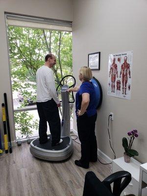 Our Physical Therapy Aide helps our patient on the use of the Powerplate.