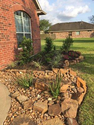 Dry creek landscaping design with irises.