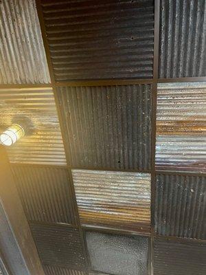 The corrugated tin ceiling